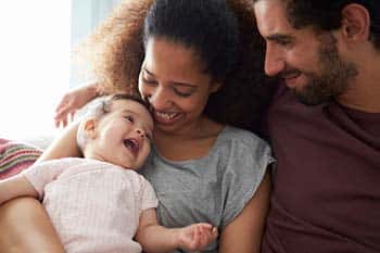 adoptive couple with baby